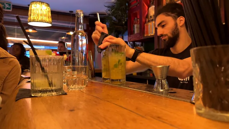 A bartender making cocktails